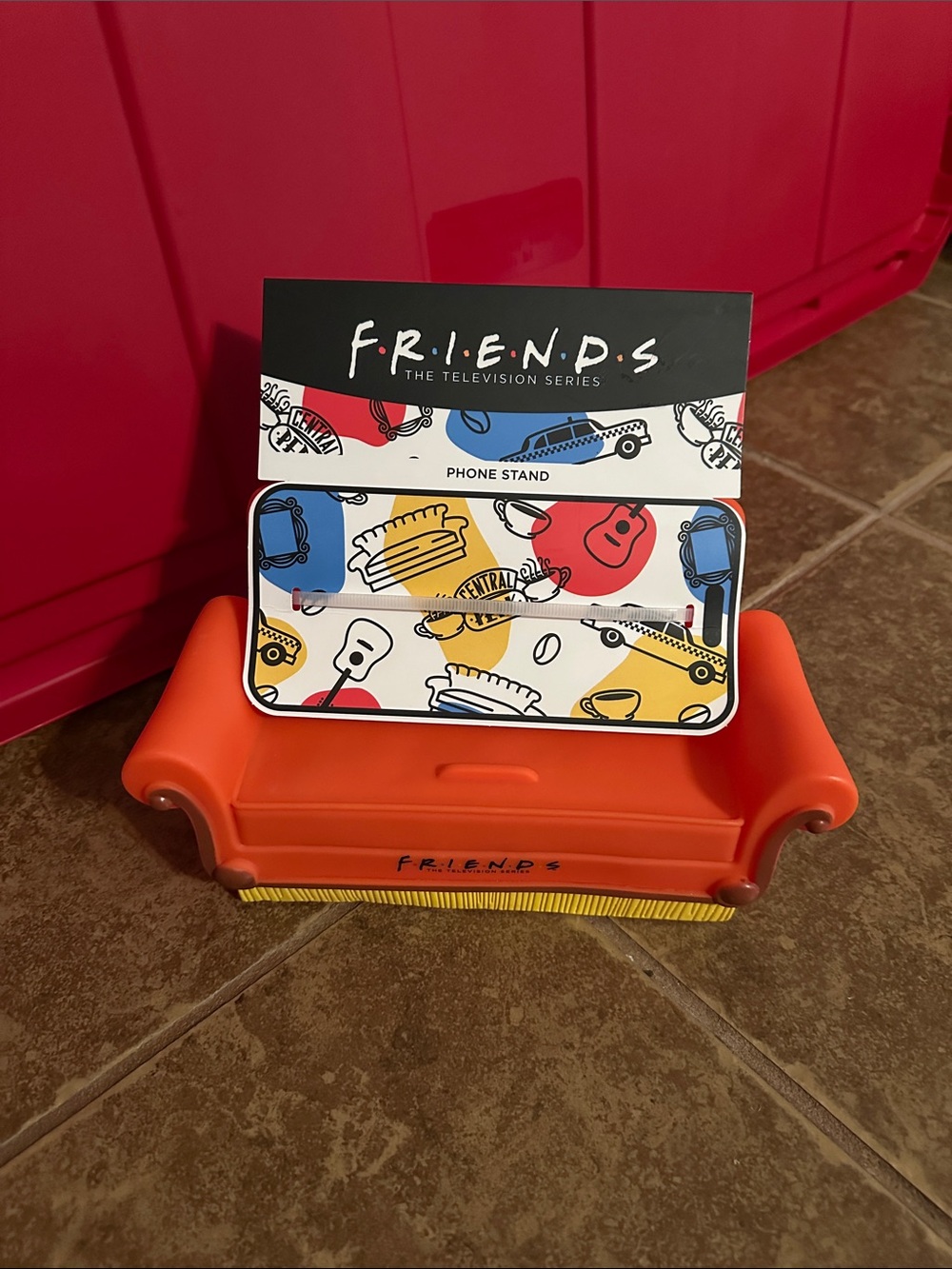 FRIENDS Orange Mini Couch Phone Stand with Multicolor Icons